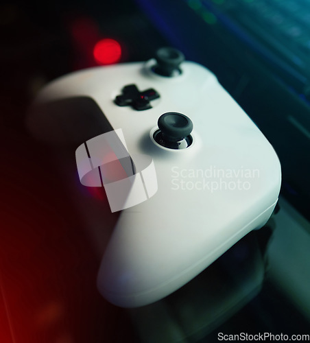 Image of Closeup of gaming controller, technology to play games and online streaming with esports and video game gadget. Gamer tools, tech on desk and live stream with digital world and streamer joystick