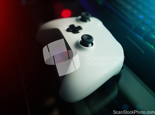 Image of Closeup of video game controller, technology to play games and online streaming with esports and gaming gadget. Gamer tools, tech on desk and live stream with digital world and streamer joystick