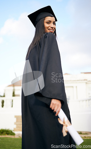 Image of Portrait, education and back with a woman graduate on university campus for a celebration event outdoor. Graduation, certificate and future with a happy young female student alone outside at college