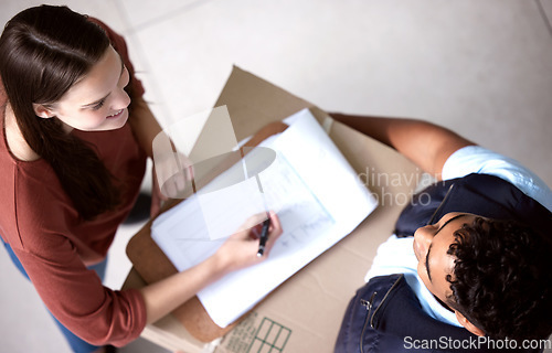 Image of Top view, courier and woman with a delivery, signature and shipping with products, ecommerce and box. Female person, customer or employee with a package, parcel or signing with document and clipboard