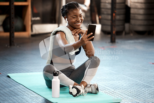 Image of Fitness, woman and exercise selfie at gym for social media platform or app. Influencer, training and health blog with black person taking workout picture for weight loss and wellness motivation