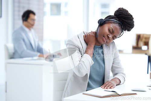 Image of Stress, tired and call center woman with neck pain, burnout or health problem in customer service or sales. Black female crm agent or tech support consultant with injury, fatigue or stretching muscle
