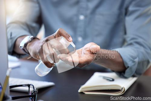 Image of Hand sanitizer, business man or working at desk with gel for covid, compliance or bacteria in office. Closeup employee or worker cleaning hands with bottle product for safety, hygiene or corona virus