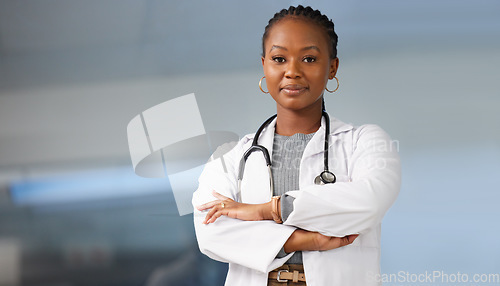 Image of Healthcare pride, portrait and a black woman with arms crossed for clinic work and medicine career. Smile, working and a professional African doctor in a medical job at a hospital with confidence