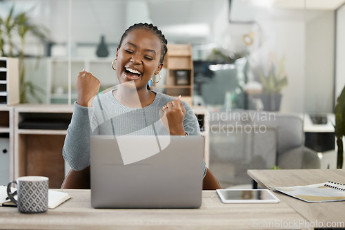 Image of Business woman, laptop and celebration with fist for winning, success or promotion bonus at office. Happy black woman employee in joyful happiness on computer for win, prize or good news at workplace