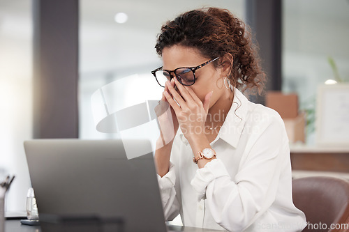 Image of Business woman, headache and stress in burnout, anxiety or depression on laptop at office. Tired or frustrated female person or employee by computer in fail, mistake or depressed problem at workplace