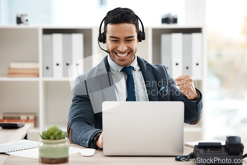 Image of Business man, fist and telemarketing success with celebration and work promotion email. Male worker, win and good news on a laptop in a office with motivation and typing at call center job with tech