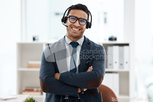 Image of Call center, arms crossed and portrait of business man in office for consulting, customer service and help desk. Smile, professional with male employee for contact us, communication and advice