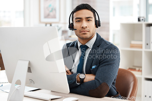 Image of Business man, call center and serious face with telemarketing and phone consultation work. Support, contact us and male worker by a computer for consultant and customer service in a office with tech