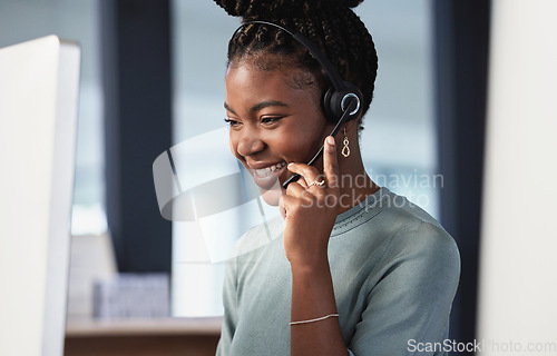 Image of Call center, customer service and contact us with a black woman consultant working in her office at night. Support, crm and consulting with a happy young female employee at work in telemarketing
