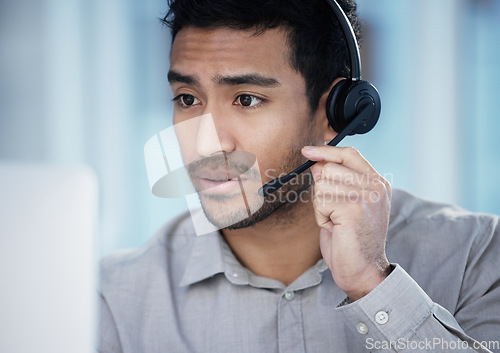 Image of Listening, call center and business man on computer for telemarketing, customer service and support in office. Crm, contact us and Asian male sales agent, consultant and professional with microphone.