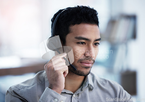Image of Call center, listening and business man telemarketing, customer service and support in office. Crm, contact us and Asian male sales agent, consultant and professional working, consulting or help desk