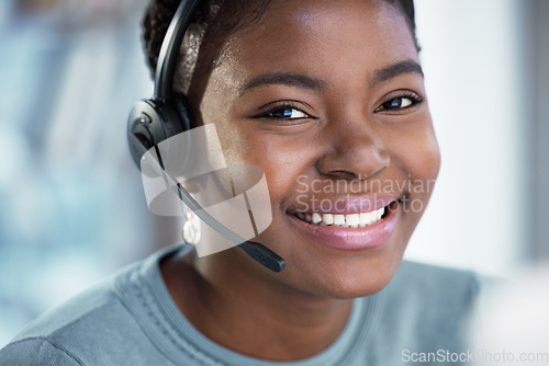 Image of Call center, face and black woman smile for telemarketing, customer service and support in office. Portrait, contact us and African female sales agent, crm consultant and happy employee from Nigeria.