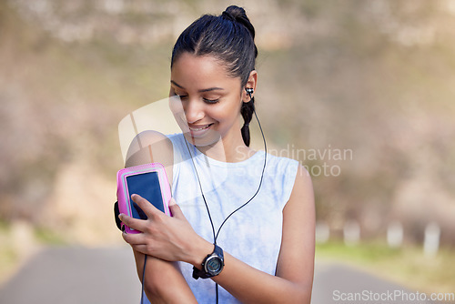Image of Phone, arm and woman for outdoor fitness music, wellness podcast and exercise progress, heart and cardio health. Biometric, data and mobile app of athlete, runner or sports person listening in street