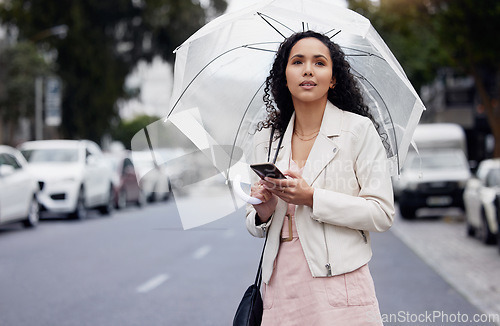 Image of Woman, city and smartphone with umbrella, thinking or lost with connection, network or insurance. Female person, girl or cellphone with cover, outdoor or walking in the street, search or website info