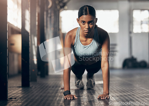 Image of Push ups, challenge and portrait of woman in gym for workout, exercise and performance. Health, strong and sports with female bodybuilder training in fitness center for energy, wellness and focus
