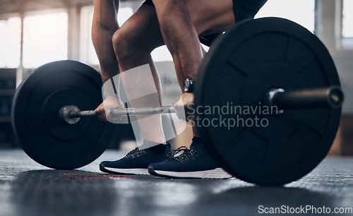 Image of Gym, fitness and man with hand for lift weight in a closeup for a workout with athletic body . Male trainer, barbell and lifting with exercise for strong muscle at the club for training for sport.