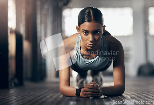 Image of Push ups, training and portrait of woman in gym for challenge, exercise and performance. Health, strong and sports with female bodybuilder and workout in fitness center for energy, wellness or focus