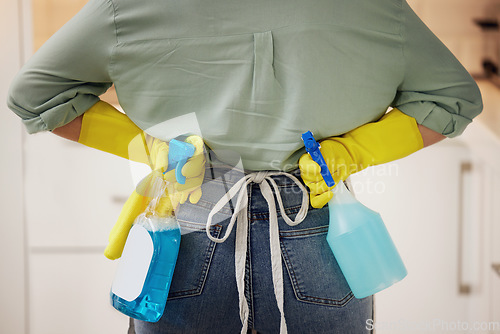 Image of Spray bottle, cleaning and hands of woman ready for hygiene, housework and chores at home. Housework, housekeeping and back of cleaner or maid with detergent, chemical and antibacterial products