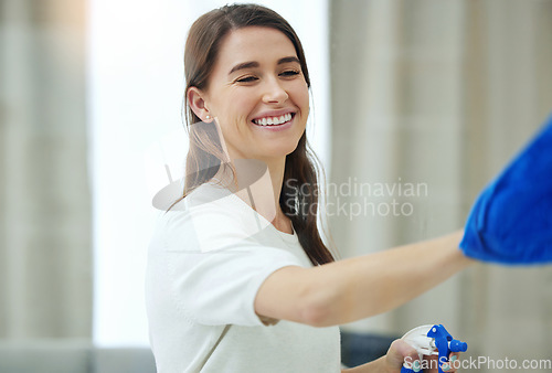 Image of Spray bottle, cleaning window and woman with smile for hygiene, housework and chores at home. Housework, housekeeping and happy female person with detergent, chemical and antibacterial products