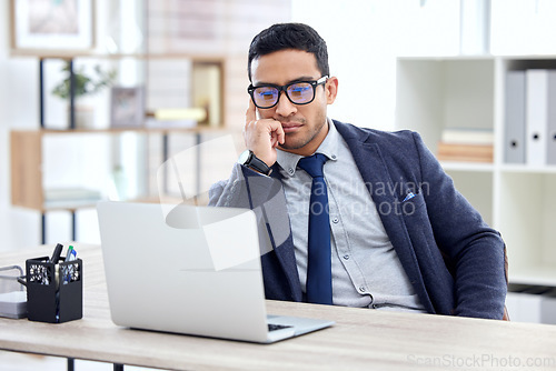 Image of Businessman in glasses, thinking or reading on laptop in office, desk or corporate workplace with professional employee. Man, business and focus on working, planning or entrepreneur busy on computer