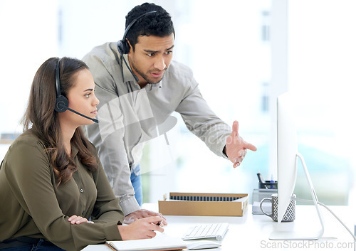 Image of Call center, man coaching woman and advice in modern office with notes, listening and learning at telemarketing job. Crm, teaching and reading for customer service, consulting or question by computer