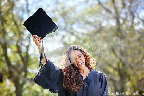 Image of Celebration, happy and portrait of a woman at her graduation standing outdoor at university. Happiness, smile and female student with graduate cap for success and college degree achievement on campus