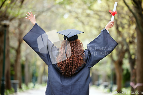 Image of Celebration, back view of university student and with certificate outdoors. Success or achievement, graduate or happiness and winner woman at college campus outside on graduation day for diploma