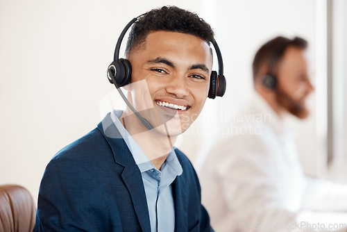 Image of Portrait, call center and happy agent working in office of customer service, support or job in crm communication. Man, contact us and telemarketing sales employee or online consulting career