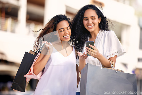 Image of Phone, online shopping and friends or women in city, social media and reading news, sale or discount on retail website. Ecommerce, bag and happy african people on mobile app, newsletter or promo code