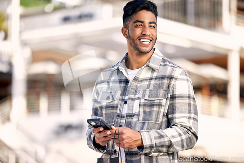 Image of Retail, city and man with a smartphone, shopping and connection with boutique item, buyer and customer. Male person, client or shopper with a cellphone, outdoor or fashion with mobile app or products