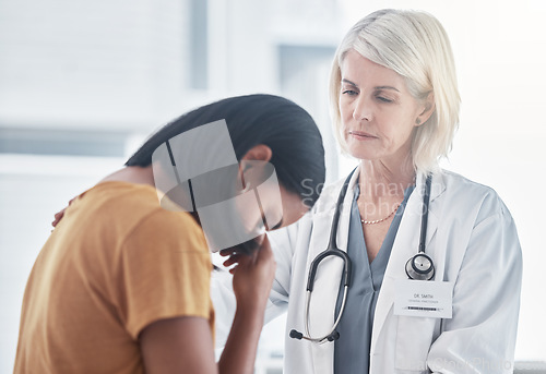 Image of Healthcare, empathy and doctor with a woman after diagnosis of cancer or sickness. Sad, comfort and grieving patient crying for results in a consultation with a female medical worker in the hospital.