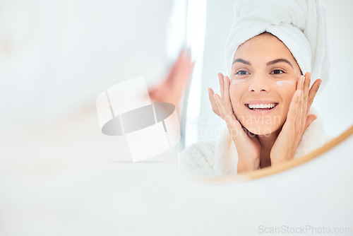 Image of Mirror, skincare and face cream for woman in bathroom for dermatology, anti aging and wellness in her home. Facial, sunscreen and happy female person with lotion, spf or glowing skin beauty treatment