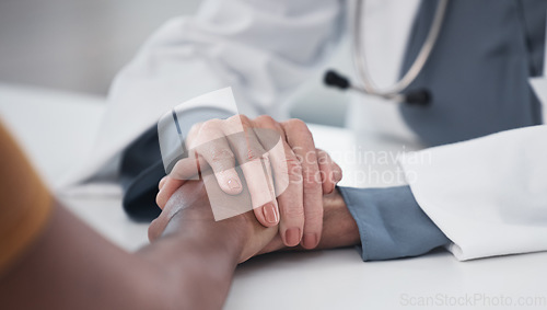 Image of Empathy, closeup and holding hands of doctor and patient for medical, support and advice. Medicine, healthcare and help with people in hospital consulting room for depression, compassion and hope