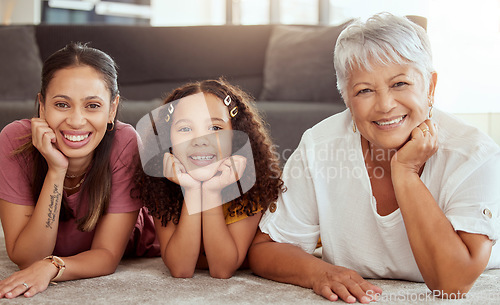 Image of Happy, generations and portrait with family on floor of living room for bonding, smile and love. Happiness, faces and grandmother with young child and mom at home for solidarity, support and weekend