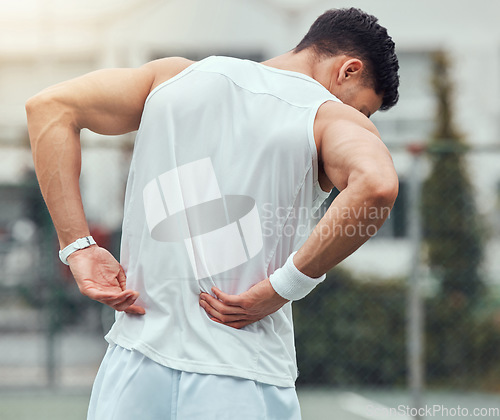 Image of Fitness, back pain and man in city for running, workout or cardio with hurt, bruise or problem. Sports, injury and male runner outdoor with spine, muscle or bone, arthritis and sports accident