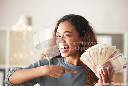 Image of Happy woman is pointing at cash fan, savings and finance with success and celebrate financial goals. Budget, winning and wealth with money, investment and female person winner with salary bonus