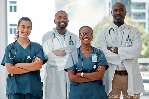 Image of Hospital, collaboration and portrait of doctors with crossed arms for medical care, wellness and support. Healthcare, happy and men and women workers for cardiology service, consulting or insurance