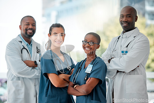 Image of Hospital, happy team and portrait of doctors with crossed arms for medical care, wellness and support. Healthcare, diversity and men and women workers for service, medicine and consulting in clinic