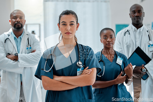 Image of Hospital, serious team and portrait of doctors with crossed arms for medical care, wellness and support. Healthcare, clinic and men and women workers for cardiology service, consulting and insurance