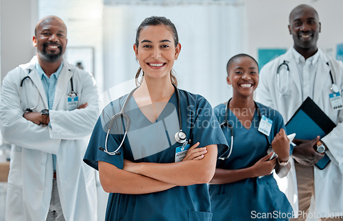 Image of Teamwork, happy and portrait of doctors with crossed arms for medical care, wellness and support. Healthcare, hospital and men and women health workers for cardiology service, consulting or insurance