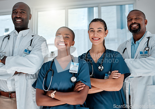 Image of Group, doctors and portrait with arms crossed, smile and hospital teamwork with solidarity, women and men. Doctor, team and people with happiness, medical collaboration and healthcare in clinic job