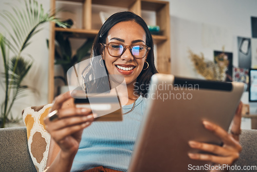 Image of Woman on sofa with tablet, credit card and ecommerce payment for online shopping with fintech at home. Happy female customer, digital bank app and sale on store website with internet banking in house