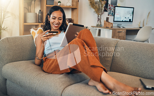 Image of Woman on sofa with tablet, credit card and online shopping of fintech payment on ecommerce at home. Happy female customer in apartment, bank app or sale on store website with digital internet banking