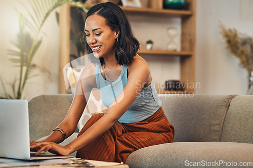 Image of Laptop writing, young woman and working from home with a smile for website. Happy freelancer, living room sofa and female person with remote work on lounge couch and typing a blog post on a computer