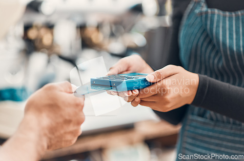Image of Credit card, machine and hands for payment in a coffee shop for shopping, bills or sale with technology. Contactless paying, electronic transaction or closeup of cafe customer at cashier for checkout
