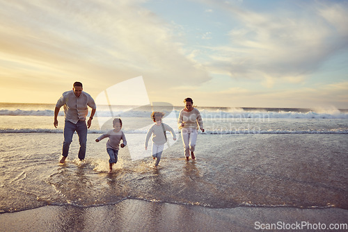 Image of Beach, sunset and parents run with children on holiday, summer vacation and weekend together. Nature, travel and happy mother, father and kids play in ocean for bonding, adventure and family time