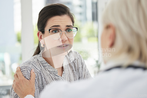Image of Patient, consultation and comfort at a clinic with stress and encouragement about cancer results. Healthcare, help and consulting with doctor at hospital for anxiety or worry with empathy with trust.