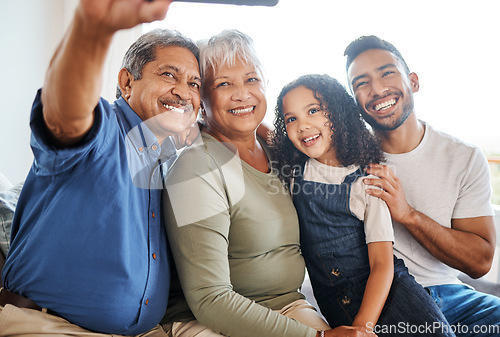 Image of Happy family, smile and selfie in living room for social media, vlog or online post at home. Grandparents, father and child smiling for photo, memory or profile picture together on holiday weekend