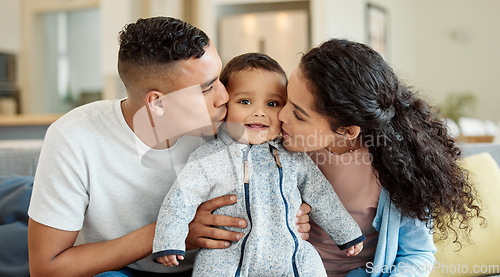 Image of Family, kiss and portrait of baby in home living room, bonding and having fun in house. Father, mother and kissing face of newborn on sofa for love, care and affection, happiness and smile together.